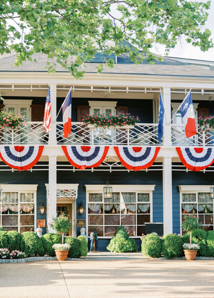 4th of July Wedding: Red, white, and blue  bunting hanging from a balcony at an inn.