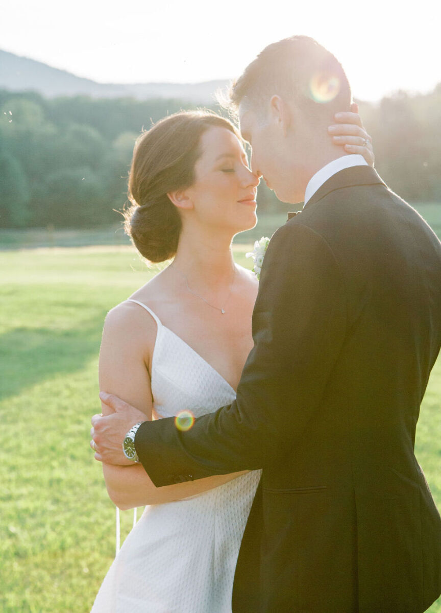 4th of July Wedding: A bride and groom embracing outdoors on their wedding day.