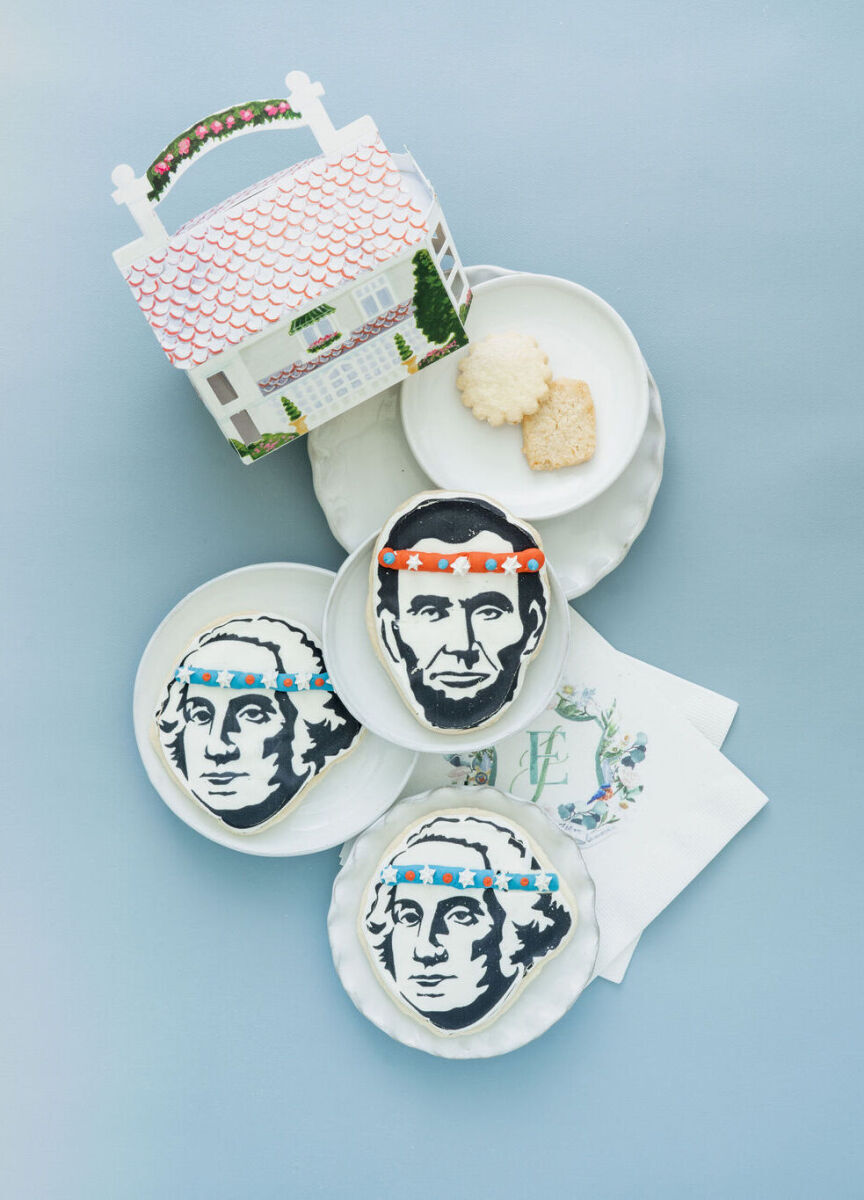 4th of July Wedding: A flat lay of customized wedding cookies with presidents' faces on them.