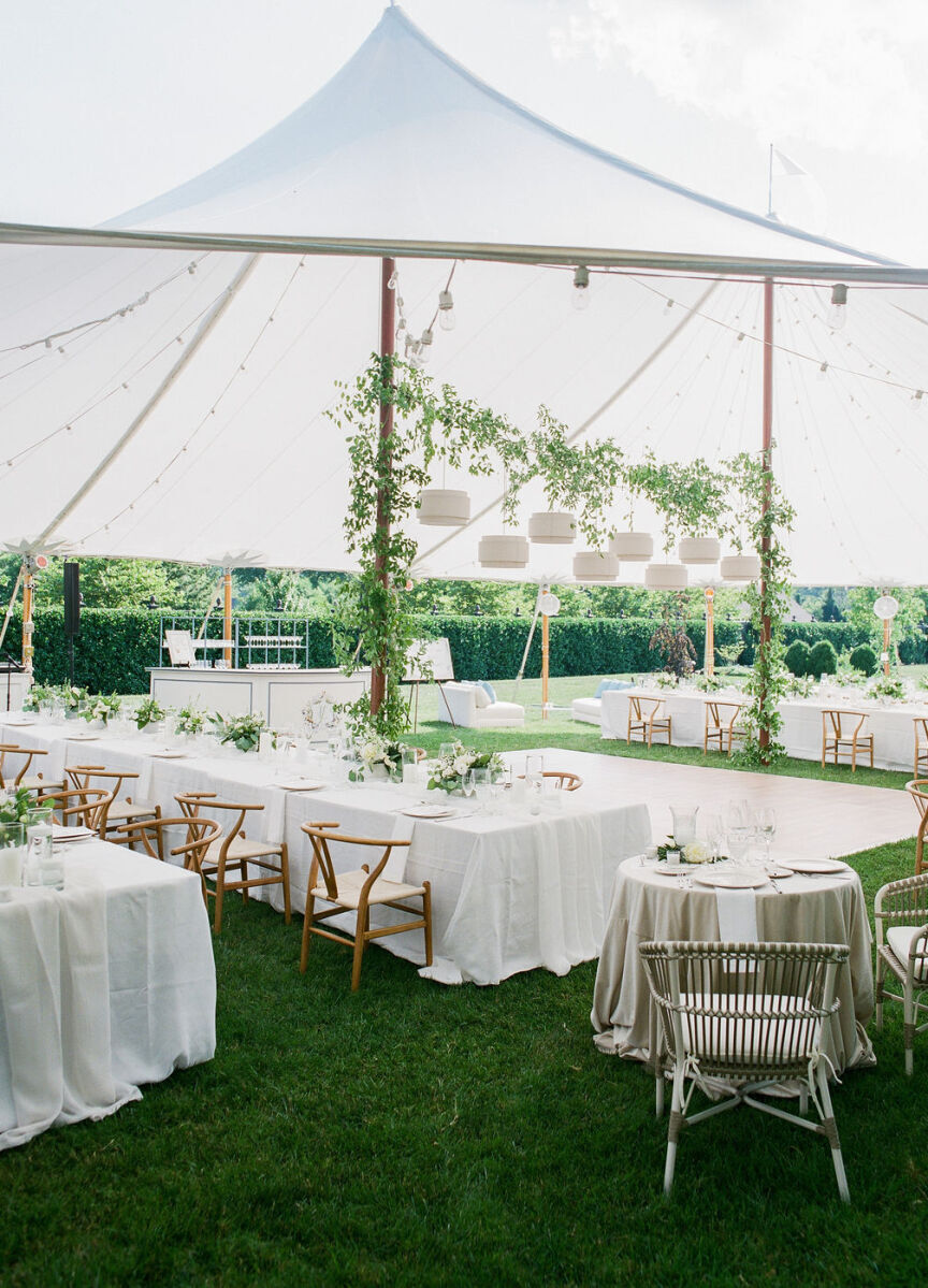 4th of July Wedding: A tented reception area set with neutral green and white decor at an outdoor wedding in Virginia.