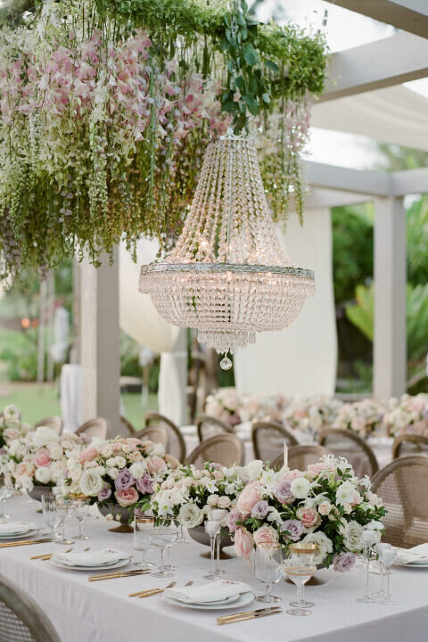 a cascade of flower petals on wire or fishing line  Hanging flowers,  Wedding day inspiration, Floral chandelier