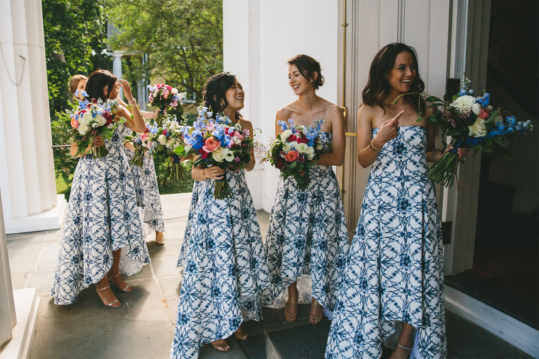 Wedding Traditions: Bridesmaids in blue and white patterned dresses.