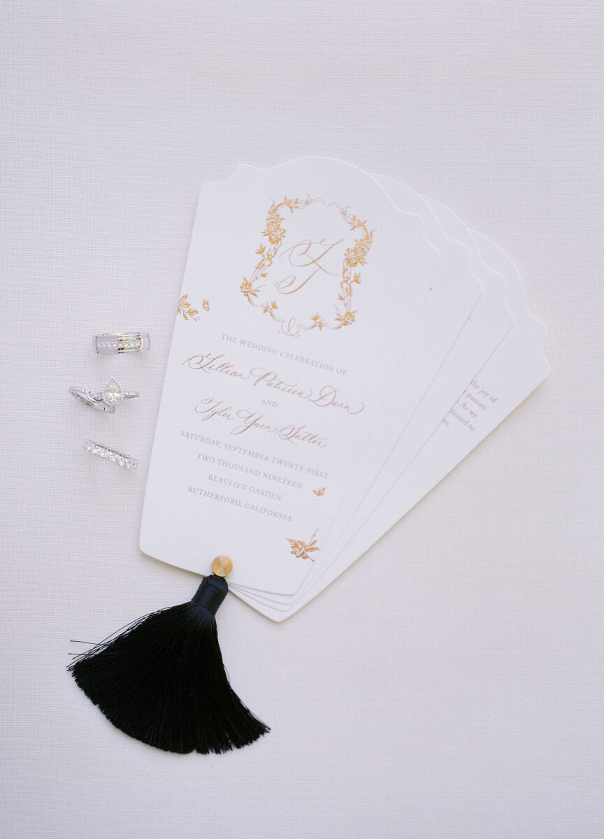 Wedding Traditions: Tasseled invitations with gold accents and the bride and groom's rings.