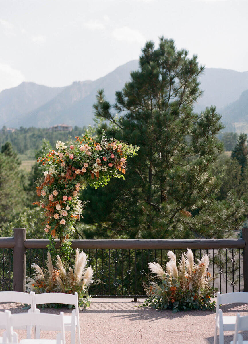 Adventurous Wedding Venues: A floral ceremony arch setup at The Broadmoor.