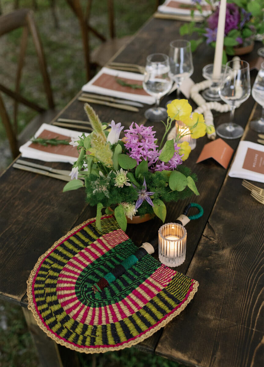 Handwoven fans were a way for an authentic modern wedding to represent the couple's backgrounds and personal style.