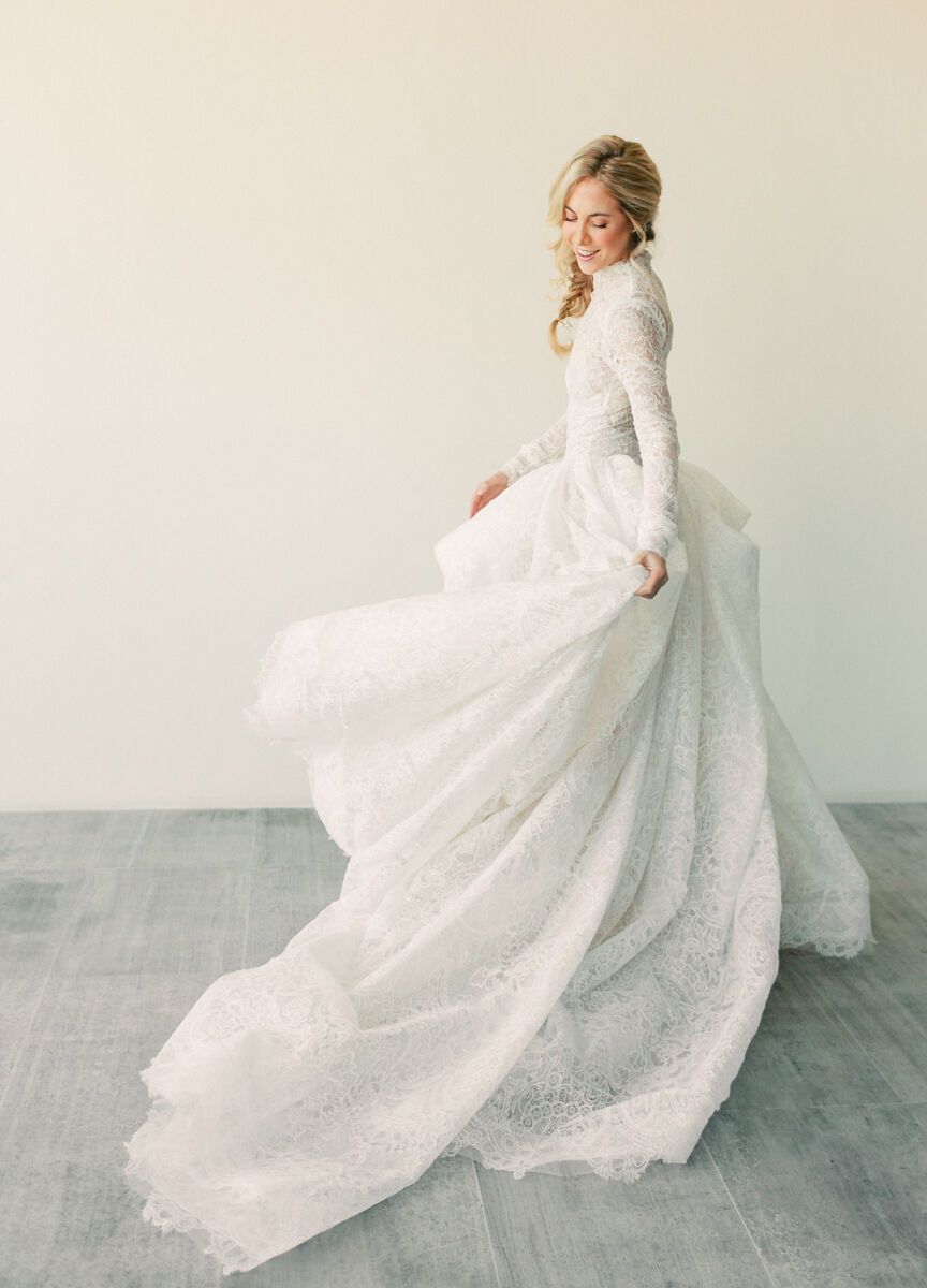 Average Wedding Dress Cost: White wedding dress on twirling bride