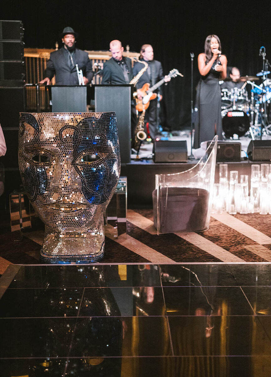 Ballroom wedding details: Specialty rental chairs, including one in the form of a face.