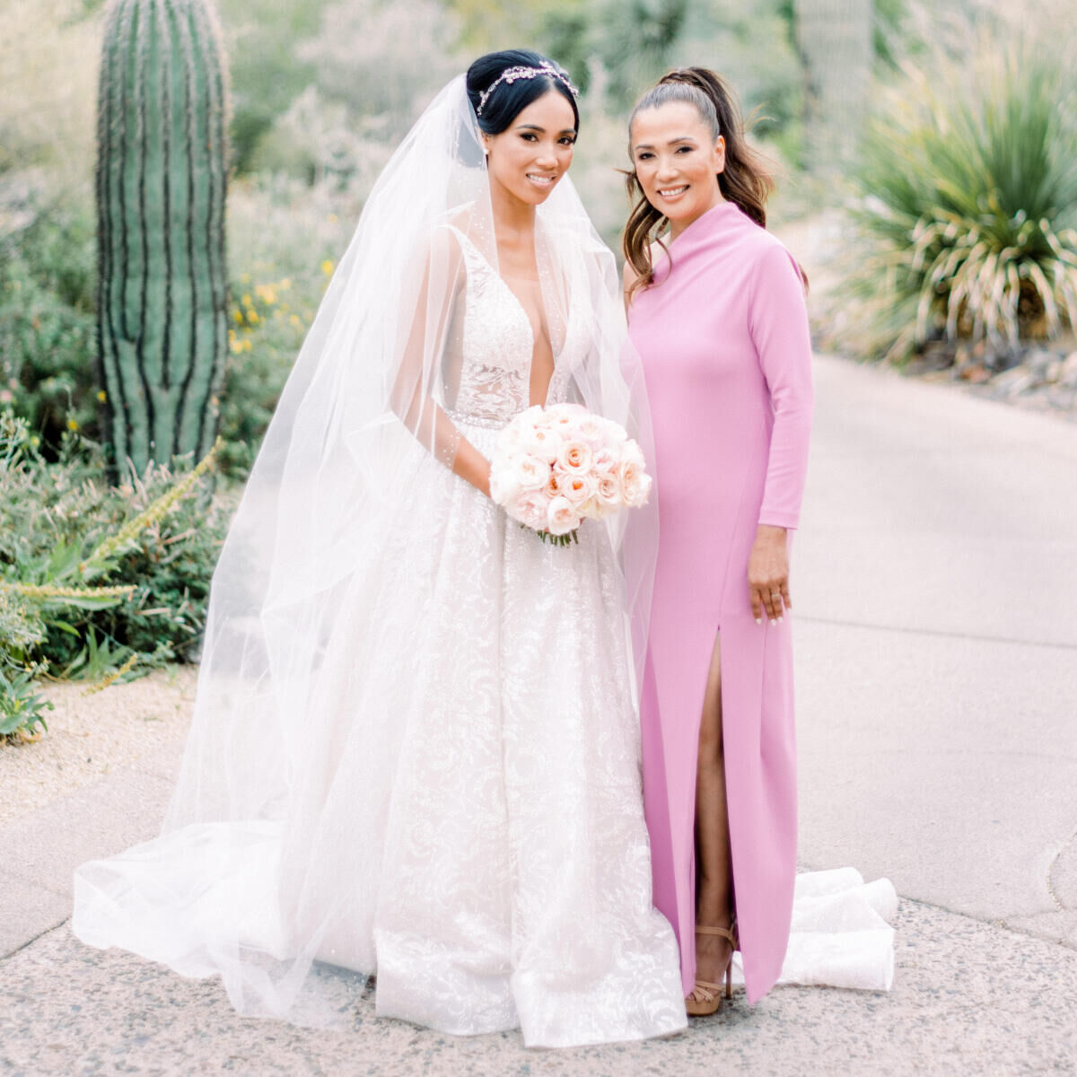 Wedding bride posing with her mother in a desert botanical garden