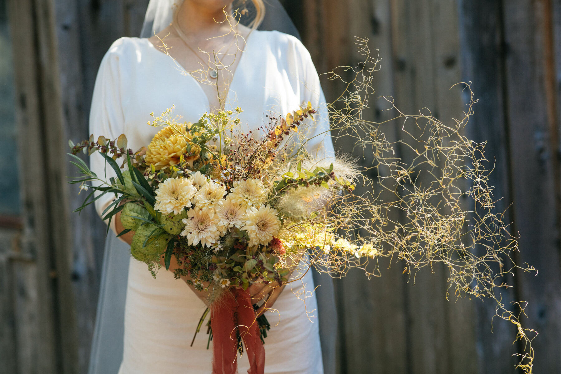 This Big Sur wedding bouquet was wild and asymmetrical, with a mix of unique blooms and greenery.