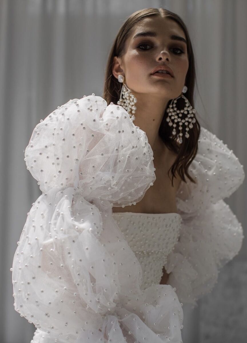 Bridal style Inbal Dror over-the-top gown with puffy accented sleeves