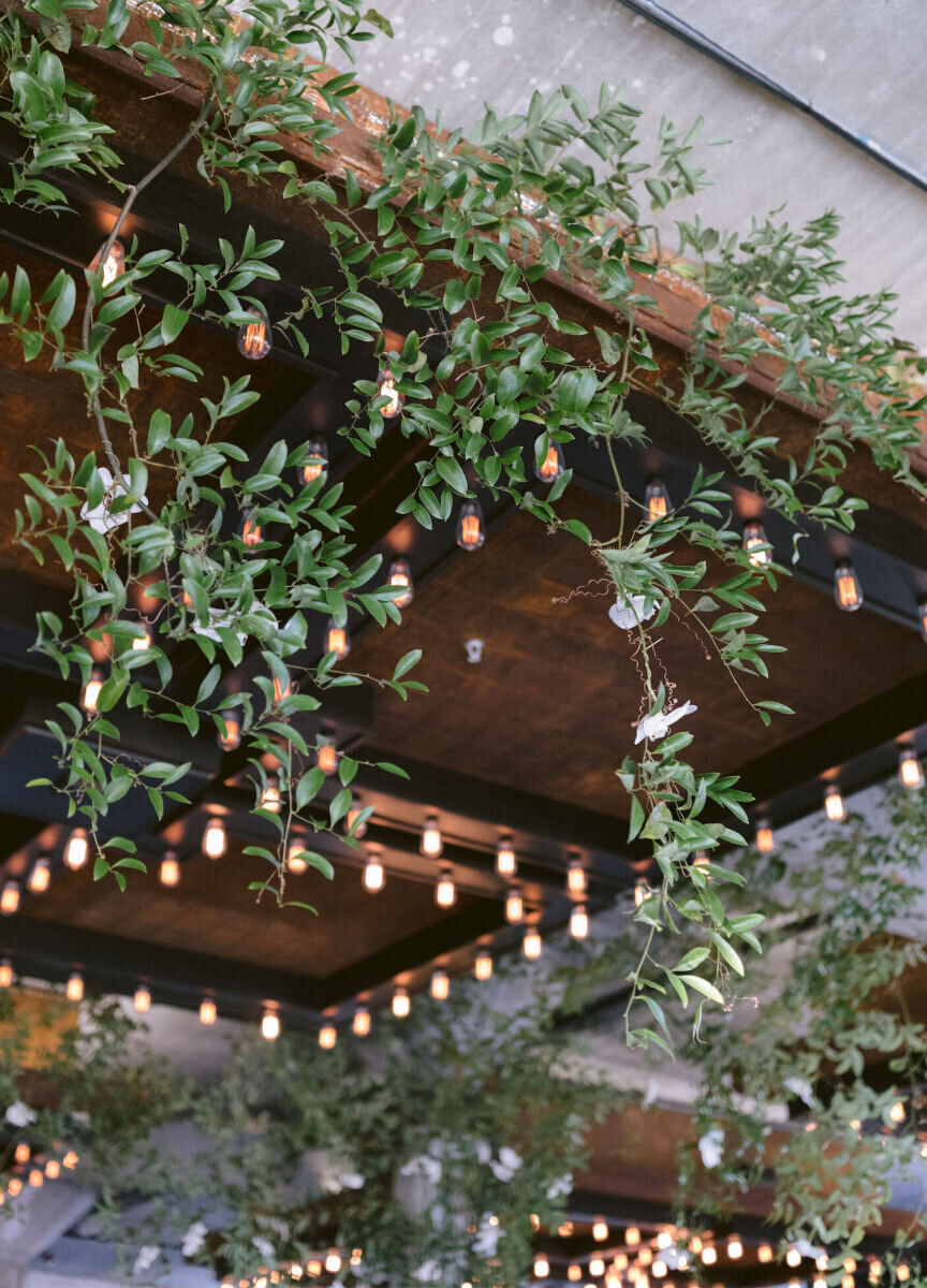 Ceiling Wedding Decor: Large wooden ceiling installations covered in greenery in Texas.