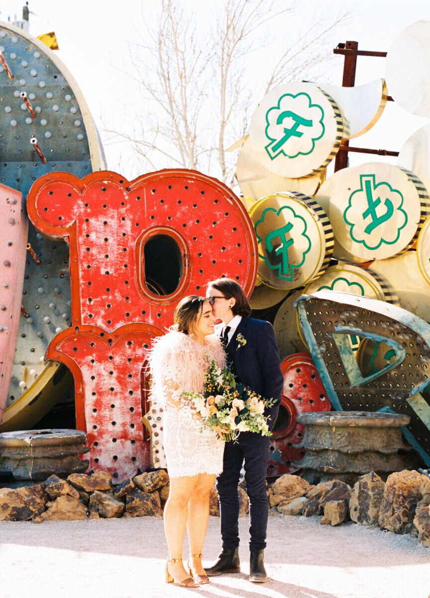 City Weddings: A wedding couple sharing a moment together at their wedding at the Neon Museum in Las Vegas.