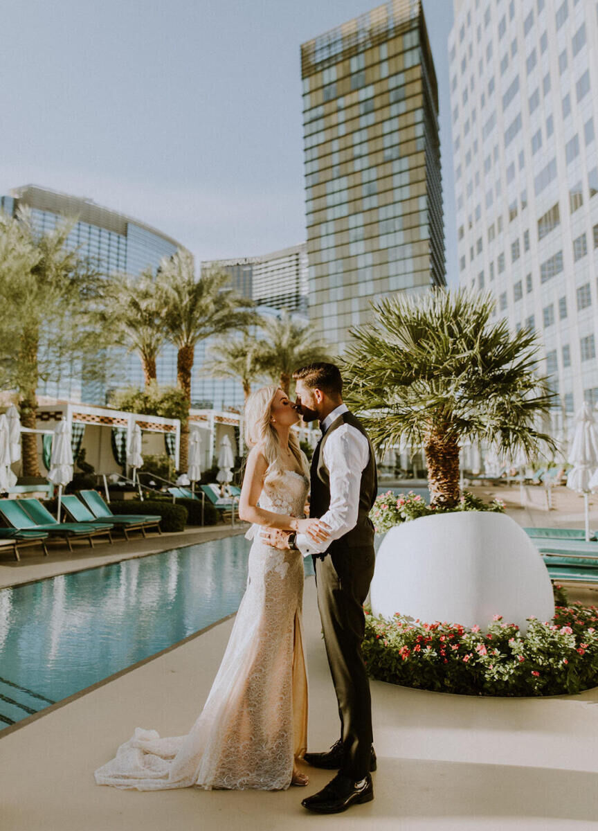 City Weddings: A wedding couple kissing poolside in Las Vegas.