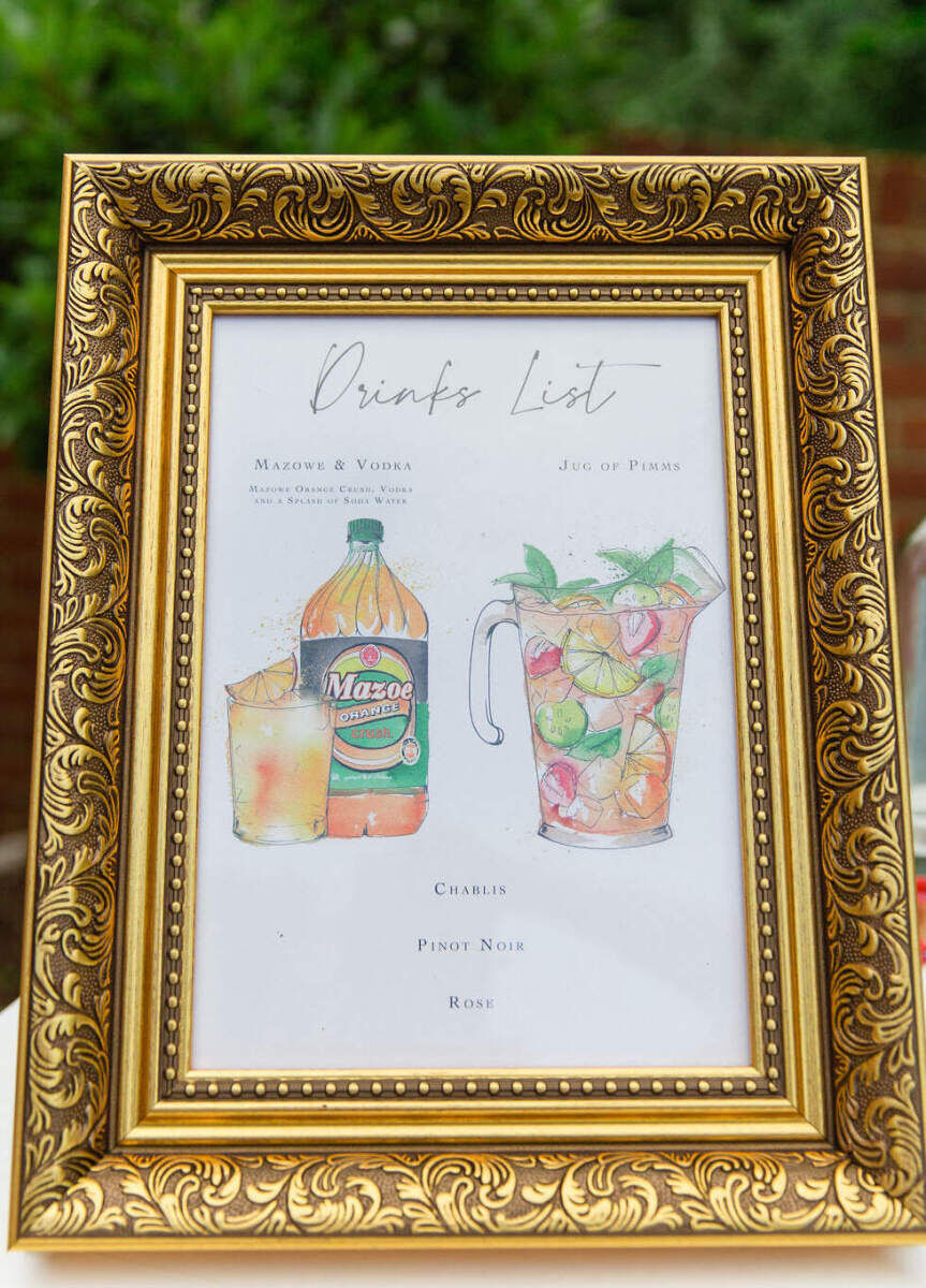A colorful countryside wedding welcome lunch offered guests drink options, including a Zimbabwean favorite.