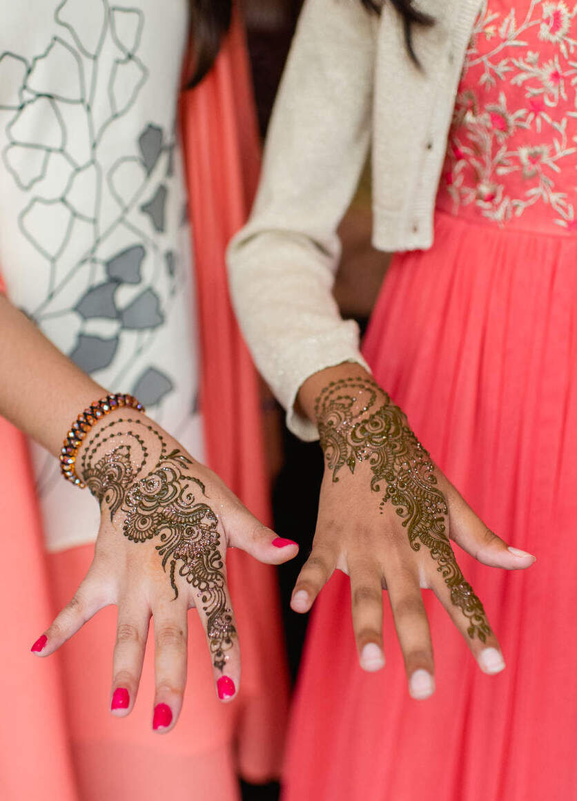 Guests had henna painted on their hands at a party in London, before a colorful countryside wedding in Hampshire, England.