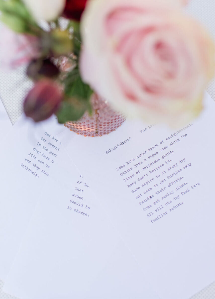 A poet typed poems for guests during a colorful countryside wedding reception.