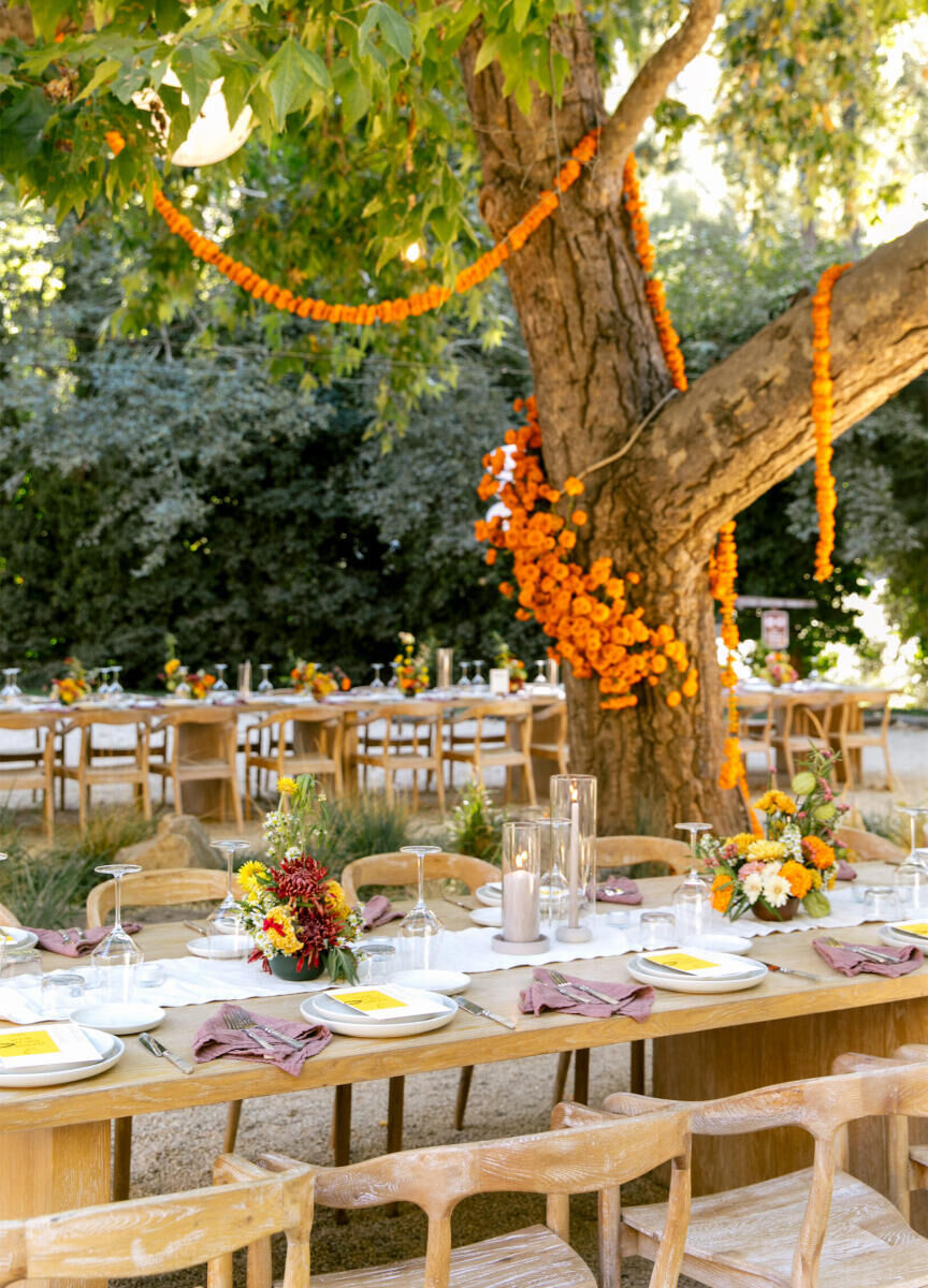 Best Places for a Colorful Wedding: An airy, orange-accented reception setup at The Village Big Sur.