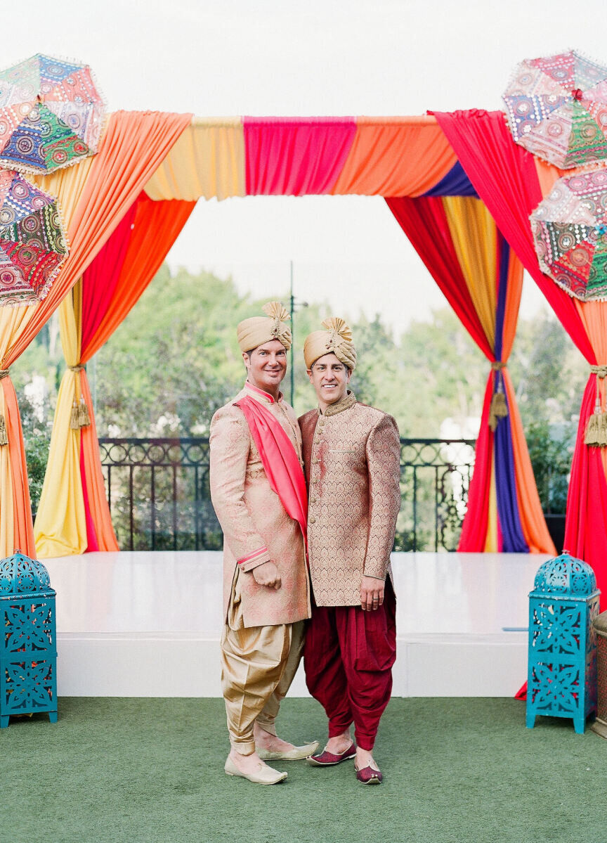 Best Places for a Colorful Wedding: Two grooms smiling arm in arm at The London West Hollywood.