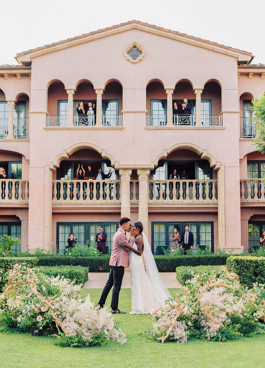 Best Places for a Colorful Wedding: A bride and groom kissing outside at the Fairmont Grand Del Mar.