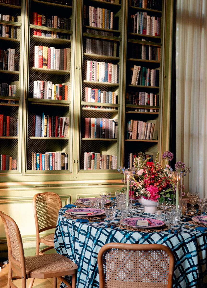 Best Places for a Colorful Wedding: A colorful reception setup at Meridian House with green bookshelves and a blue and white checkered table.