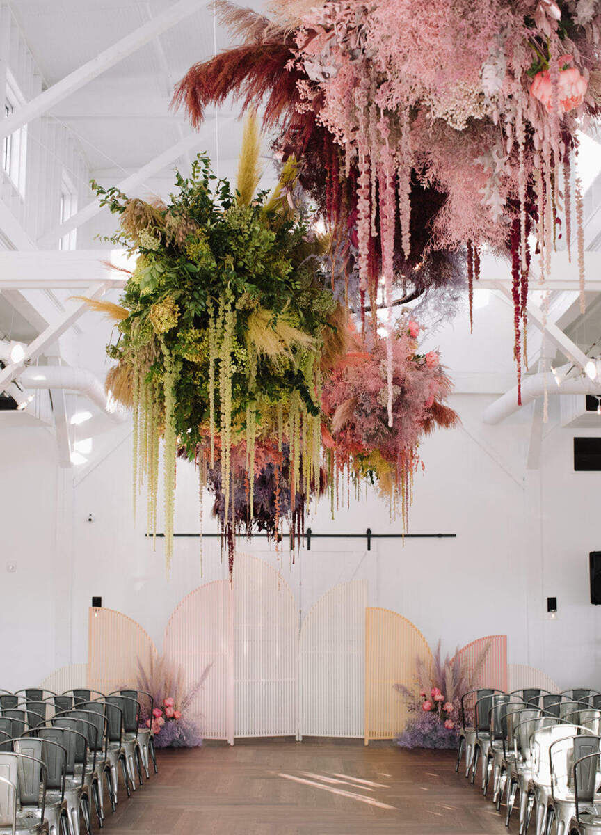 Best Places for a Colorful Wedding: A large, colorful floral installation hanging from the ceiling at 14TENN.