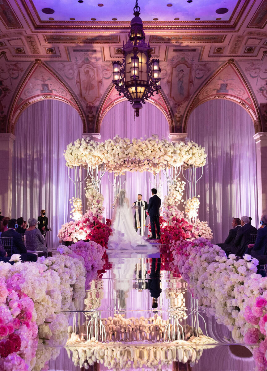 Best Places for a Colorful Wedding: A pink and purple grand ceremony at The Breakers Palm Beach.