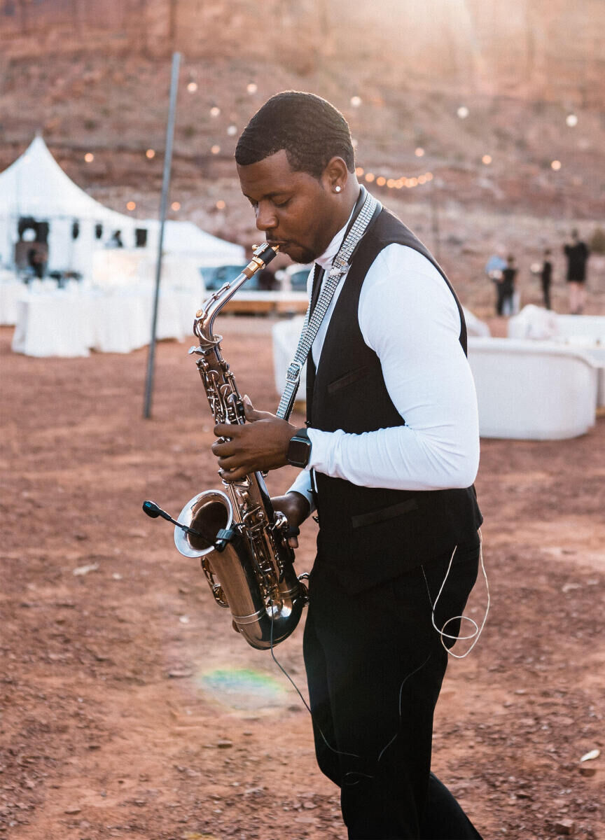 A saxophonist performs during a desert wedding in Utah.