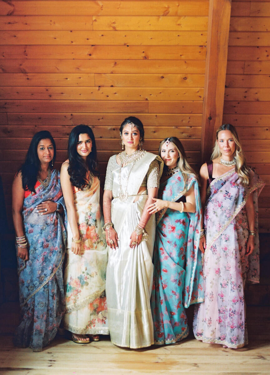 A bride and her close friends in colorful saris on the big day during her destination Indian wedding weekend.