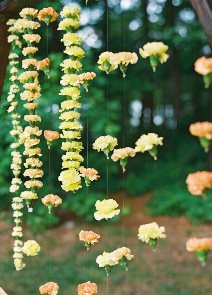 Garlands of carnations were hung for an engagement ceremony during a destination Indian wedding weekend.
