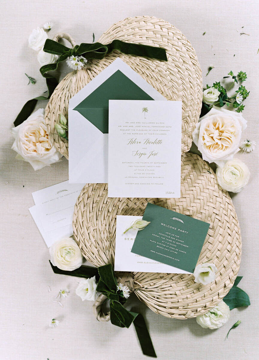 Green and white invitations were sent to guests for a destination wedding that would be designed in the same color palette. Woven fans were also used during the ceremony to keep everyone cool.