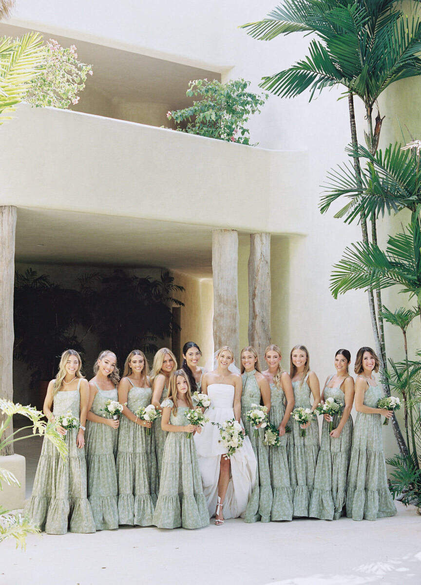 Bridesmaids wore pale green dresses designed by the bride and her cousin at a destination wedding in the Dominican Republich.