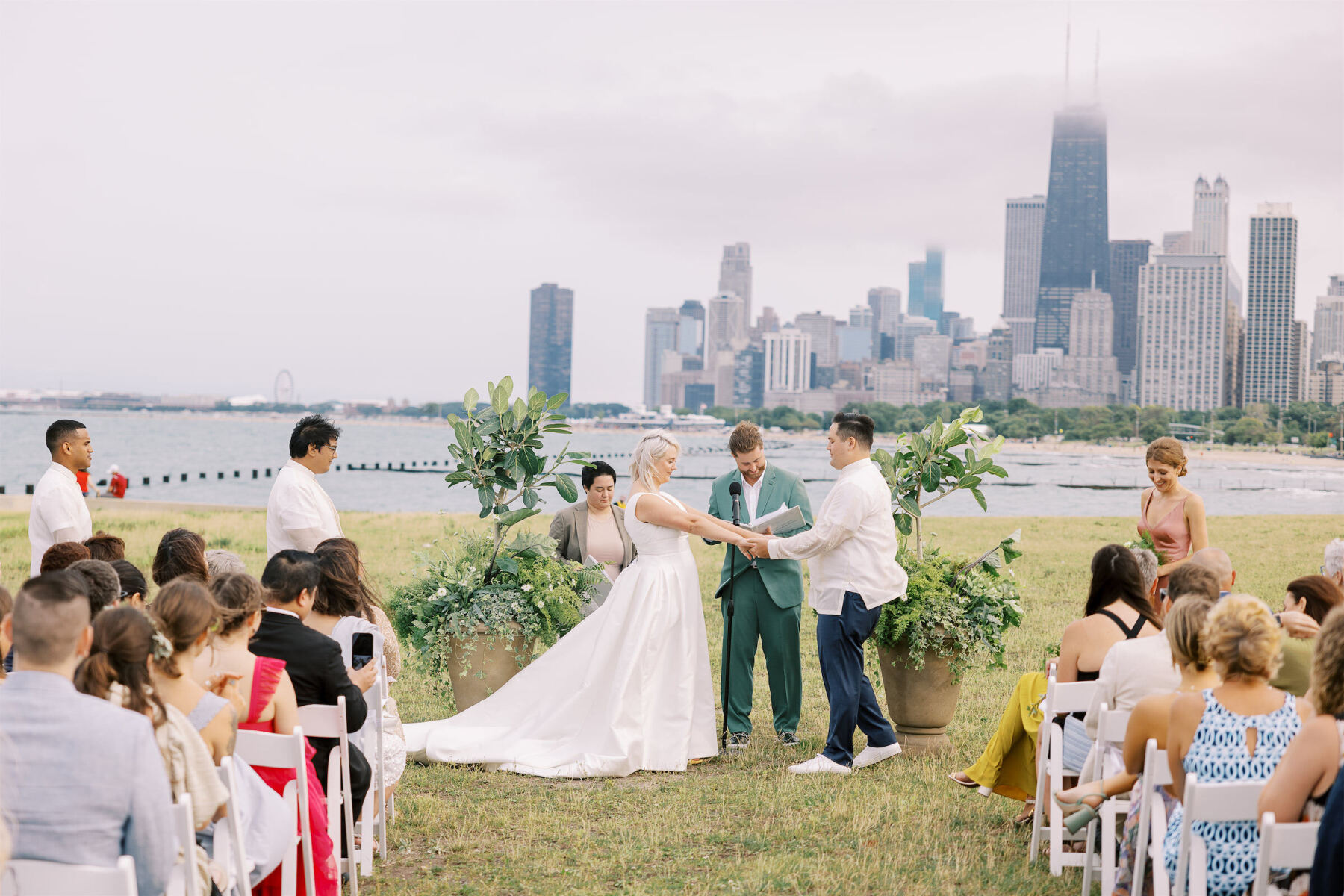 The couple's siblings officiated their enchanted waterfront wedding ceremony in front of Lake Michigan.