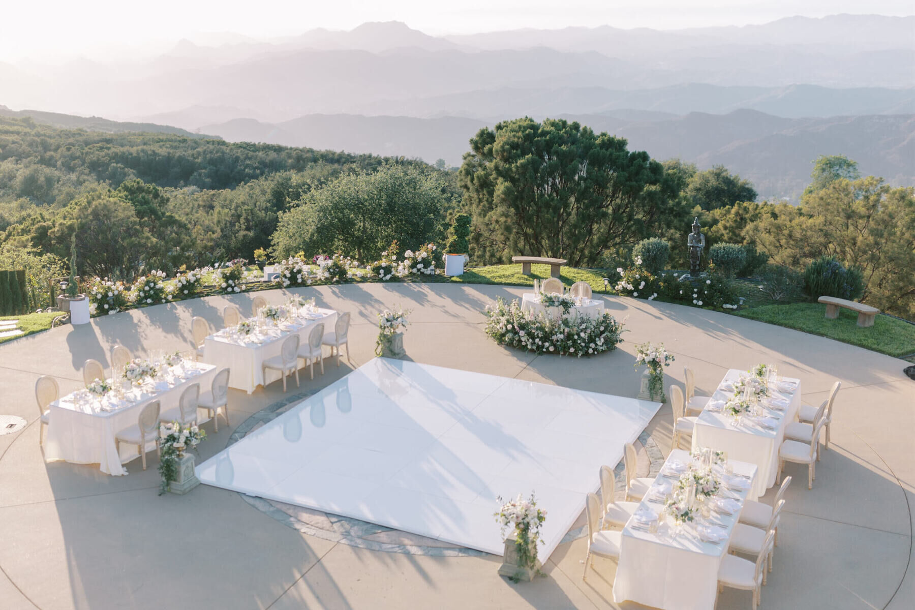 An intimate  wedding reception set up at a scenic private estate, overlooking the hills of Malibu.