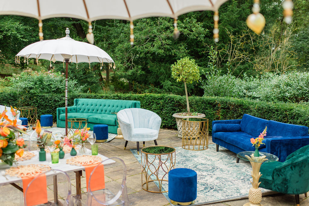 A colorful countryside wedding weekend began with a casual luncheon designed in bold shades of orange and green.