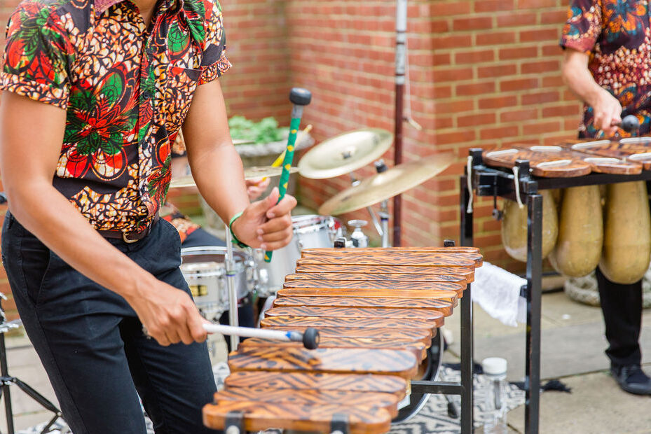 Marimba players performed during a colorful countryside wedding weekend event.