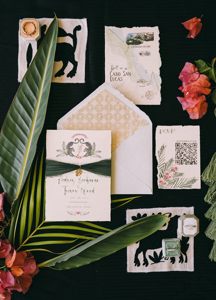 Hand-torn edges, gold accents, watercolor illustrations, and a QR code for guests to reply were all elements of a glam beach wedding invitation suite.