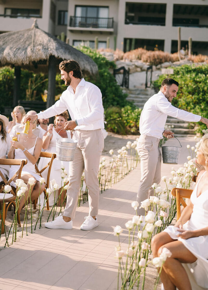 Beer boys handed out cold ones during a glam beach wedding ceremony in Cabo.