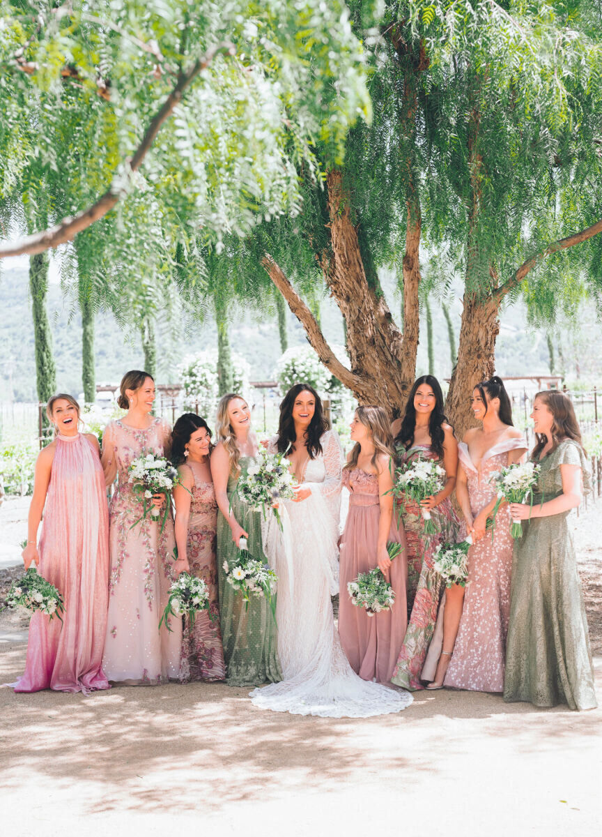 Bridesmaids wore shades of pale pink and green and carried bouquets that matched the bride's at her glam enchanted wedding.