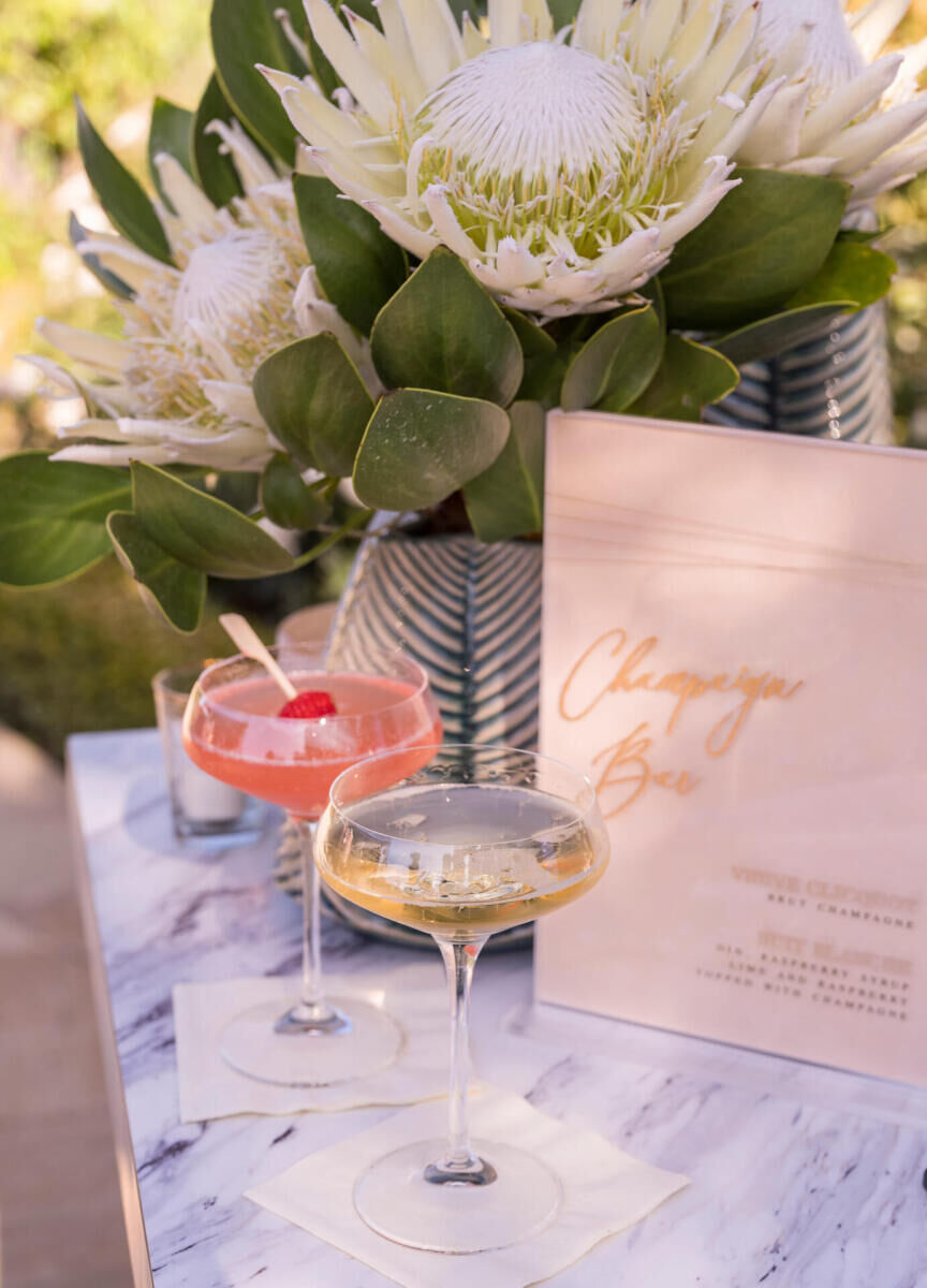 Champagne cocktails were served at the ceremony of a glam enchanted wedding.