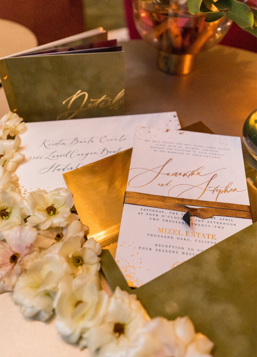 A glam enchanted wedding invitation incorporated gold foil, green velvet, and custom calligraphy.