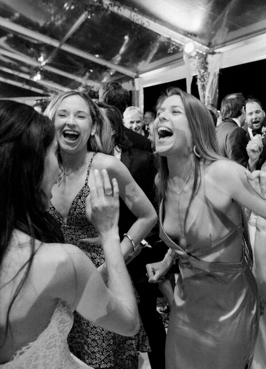 Guests dance during the reception of a glam, garden wedding in Miami.