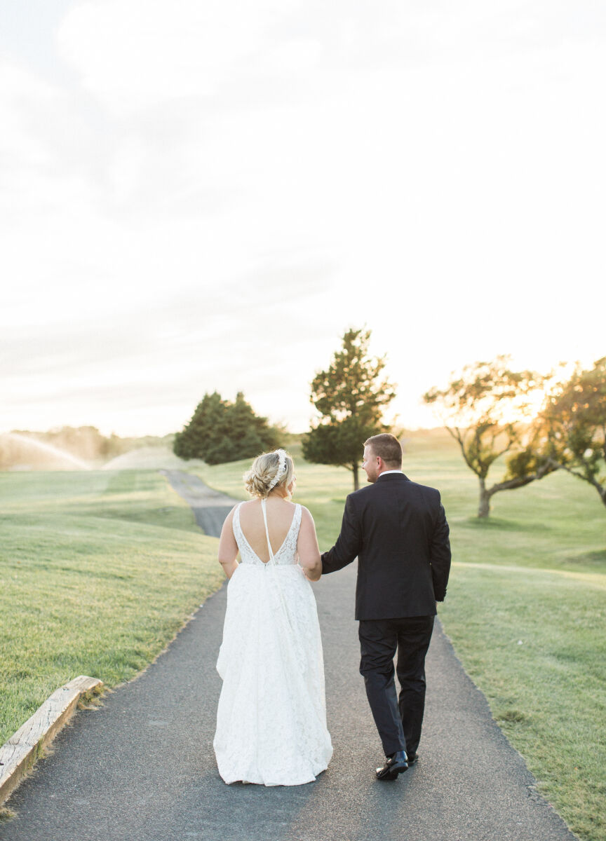 Golf Course Wedding Venues: A wedding couple holding hands on a golf course in Montauk, New York