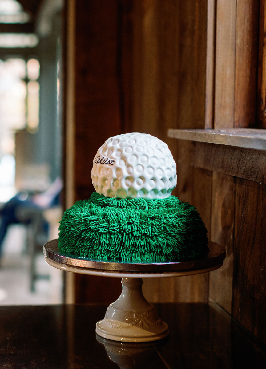 Golf Course Wedding Venues: A golf ball groom's cake is on display at a wedding in North Carolina.