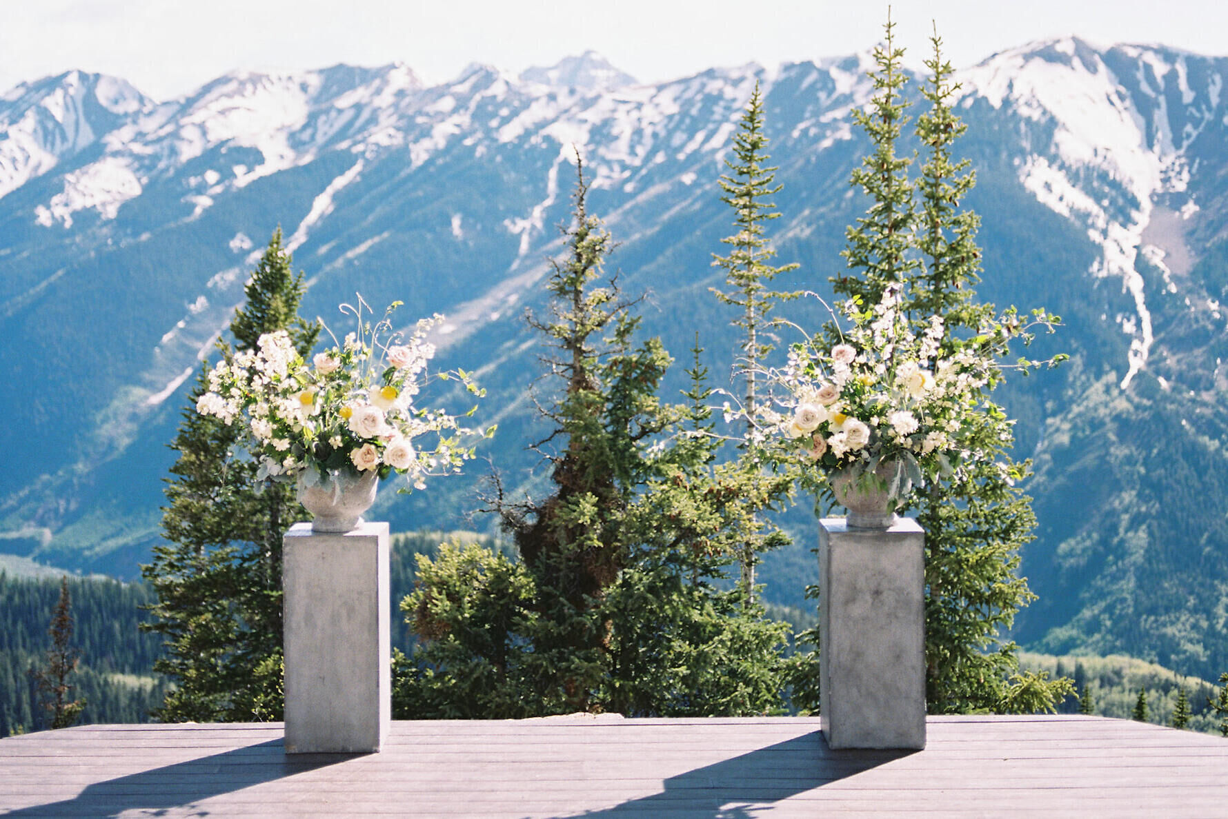 Marriage ceremony setup with mountains in background 
