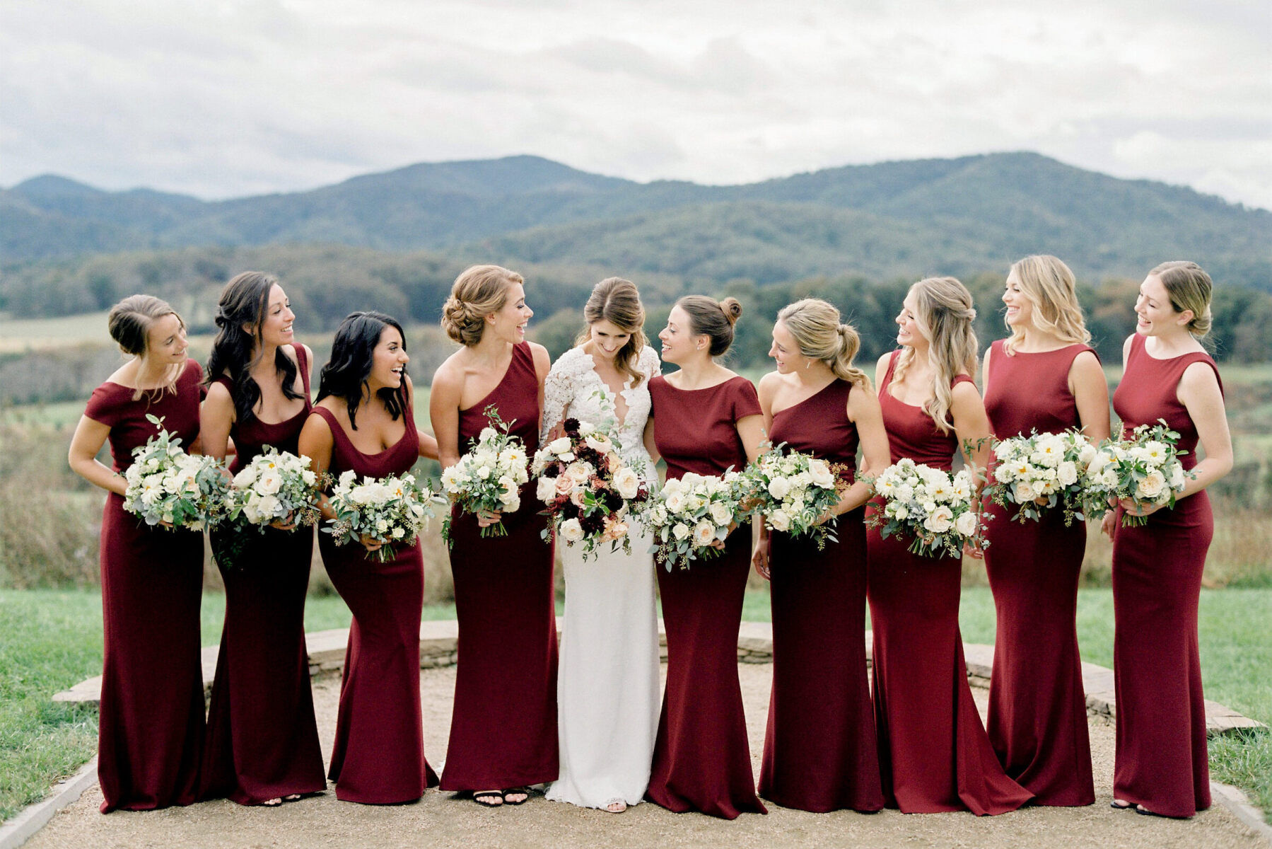 Bride and bridesmaids in front of a mountain setting