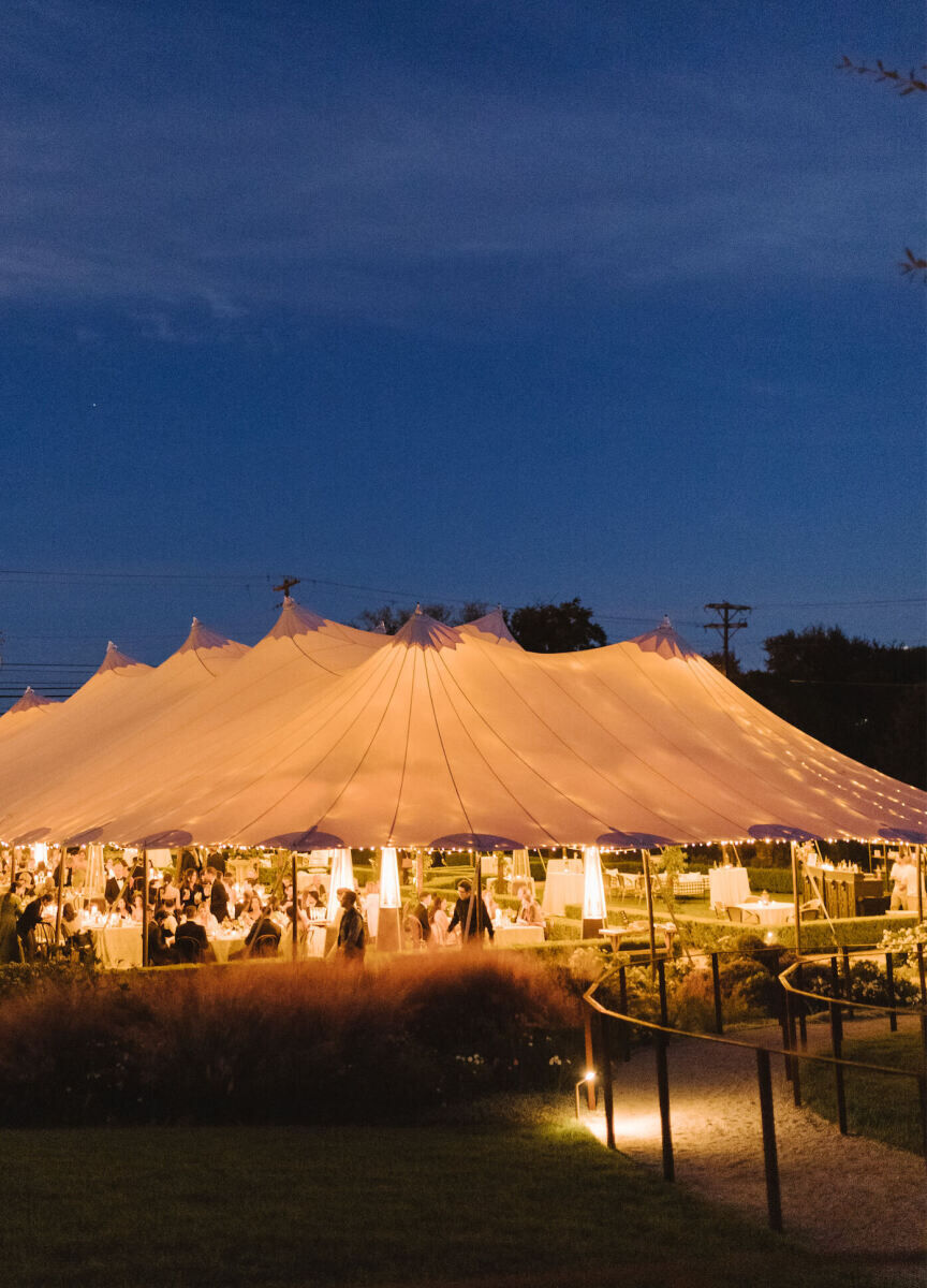 A tent is aglow as the night transpired at an Indian fusion wedding in Texas.