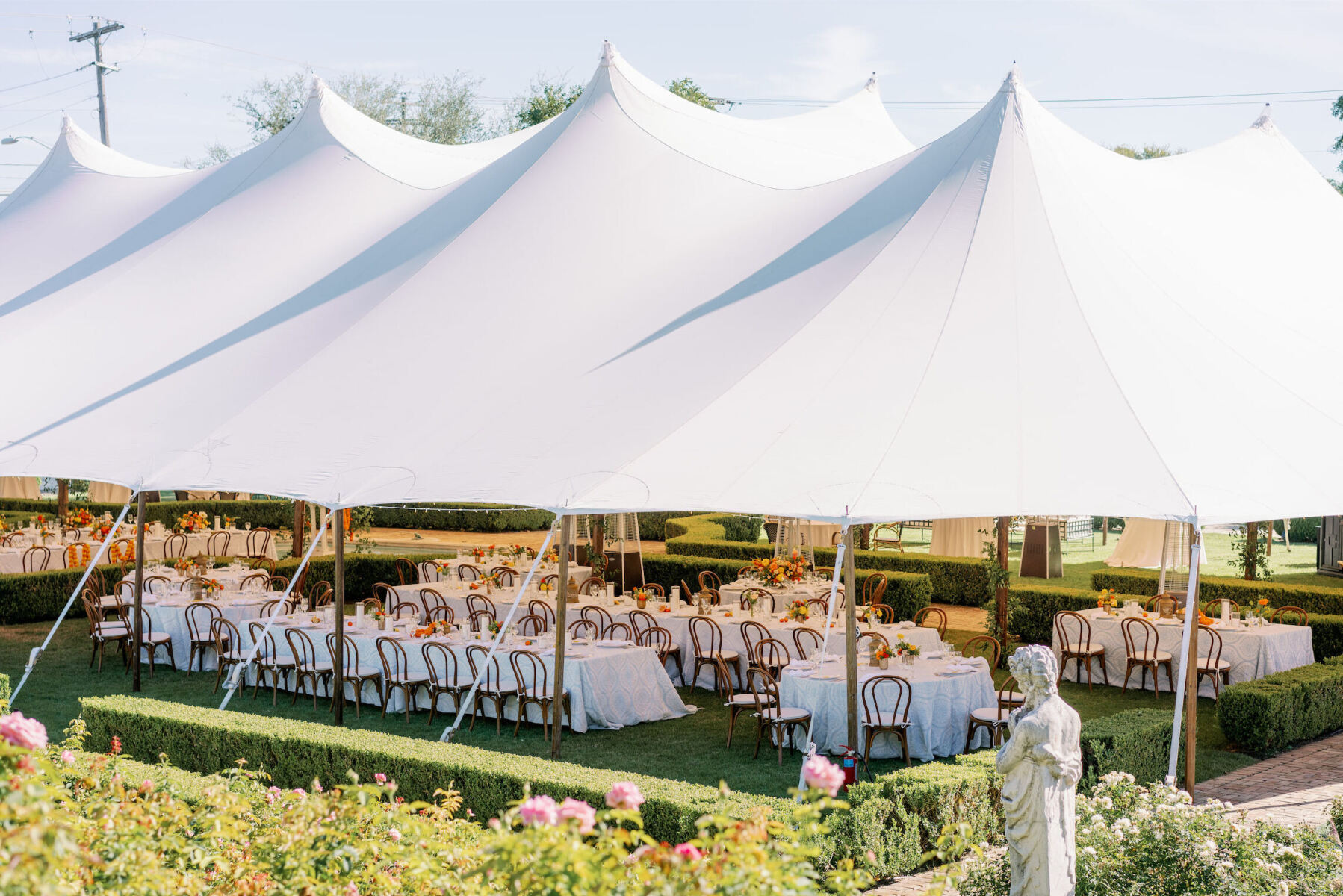 A sailcloth tent was used for the reception at an Indian fusion wedding.