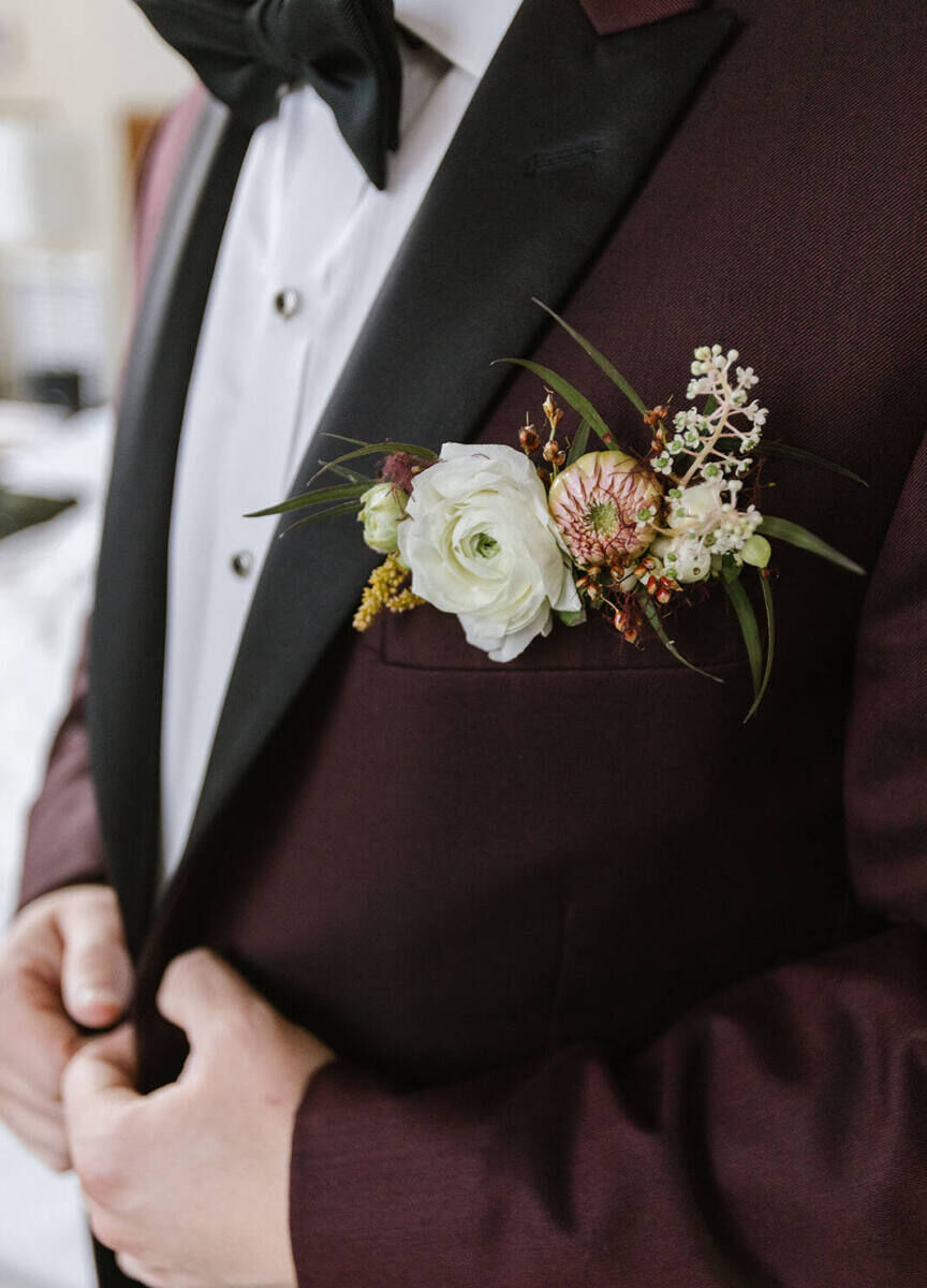 Instead of a boutonniere, this groom's dinner jacket pocket was filled with flowers—it was just one modern touch at his industrial wedding.