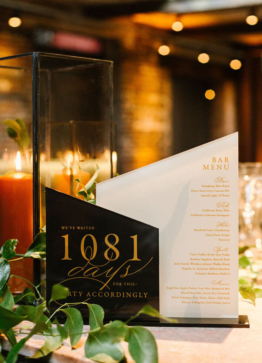 For their industrial wedding, which was postponed due to the pandemic, bar signage was customized to highlight that even with an engagement that spanned 1081 days, it was time to party.