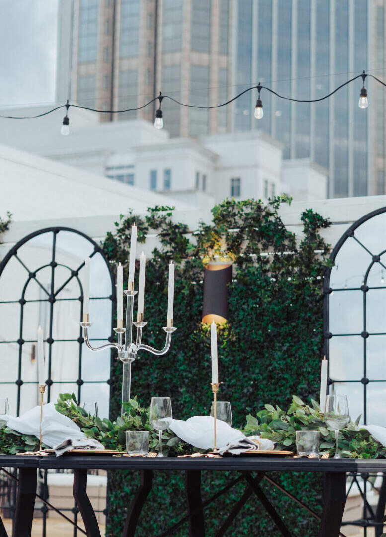 Industrial Wedding Venues: A reception table setup on the outdoor Skydeck at Studio 154 Luxury Hotel.